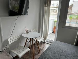 A television and/or entertainment centre at Myron Apartments