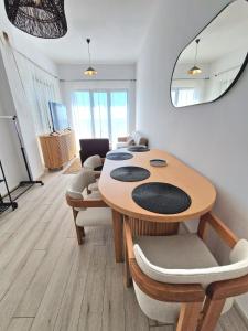 a dining room with a table and chairs at Cabacum Paradise 1 on the seashore in Varna City +14 photos