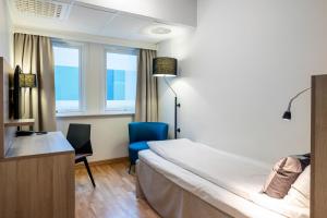 Postel nebo postele na pokoji v ubytování Quality Hotel Saga