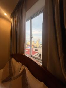 Postel nebo postele na pokoji v ubytování Madella Hotel