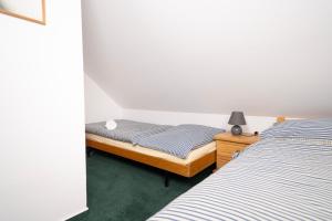 Postel nebo postele na pokoji v ubytování Penzion U Churáňů