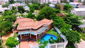 an aerial view of a house with a swimming pool at B&H Villa - Villa has swimming pool in Lang Co