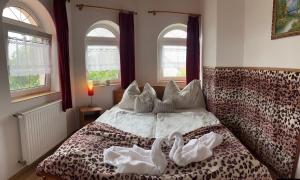 Posteľ alebo postele v izbe v ubytovaní Joker Villa Apartmanhaus + 37 fotografií