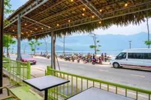 a view of a street with cars and motorcycles at B&H Villa - Villa has swimming pool in Lang Co