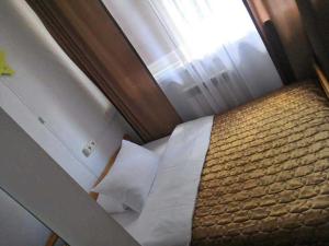 Postel nebo postele na pokoji v ubytování AUGUST Ośrodek Wypoczynkowy