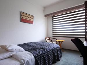 Postel nebo postele na pokoji v ubytování Hotel Claiton Shin-Osaka + 19 fotografií