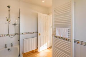 a bathroom with a shower and a walk in shower backdoor at Ednam House Hotel in Kelso