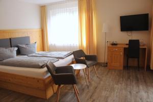 Postel nebo postele na pokoji v ubytování REGIOHOTEL Germania am Kurpark Bad Harzburg