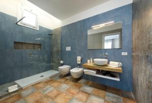 a bathroom with two toilets and a shower at Le Margherite in San Vito lo Capo +25 photos