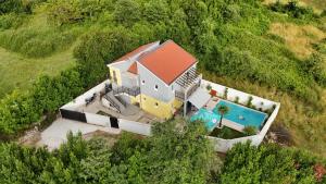 an aerial view of a house with a swimming pool at House with pool - Mitrovic in Herceg-Novi
