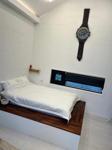 Postel nebo postele na pokoji v ubytování CC Stay 씨씨스테이
