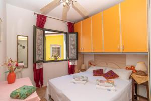 Postel nebo postele na pokoji v ubytování Villa Rosa - Casa delle Bambole