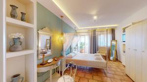 a living room with a table and a dining room at Aneria Suites in Episkopí- Rethimno +92 photos