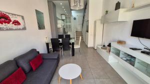 a living room with a couch and a table at Appartamento Altamar Las Americas in Playa de las Americas