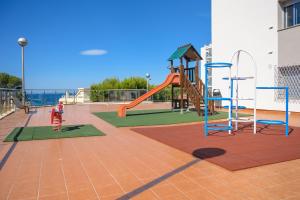 a playground with a slide and a slideintend at Albatros Family in Salou