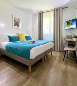 Postel nebo postele na pokoji v ubytování Hotel L'Escapade