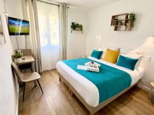 Postel nebo postele na pokoji v ubytování Hotel L'Escapade