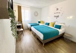 Postel nebo postele na pokoji v ubytování Hotel L'Escapade