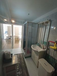 a bathroom with a tub and a sink and a mirror at TETIDE Holiday home,casa vacanze in Trapani +29 photos