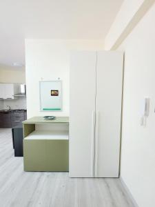 an office with a refrigerator and a desk at Casa Mary in Nocera Inferiore