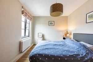 Postel nebo postele na pokoji v ubytování Le petit chapitre