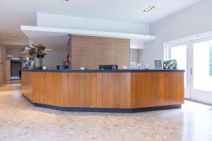 a lobby with a reception desk in a building at Fletcher Hotel Restaurant Erica in Berg en Dal +85 photos