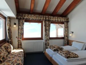 Postel nebo postele na pokoji v ubytování Hotel Fortini