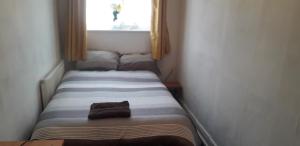 Postel nebo postele na pokoji v ubytování Spectrum Guest House