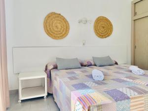 Postel nebo postele na pokoji v ubytování Hotel LLITERAS