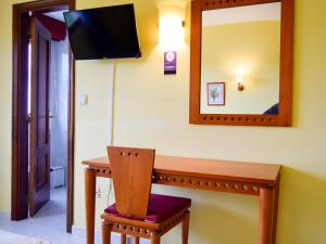 Televízia a/alebo spoločenská miestnosť v ubytovaní Hotel Acquamaris 3000