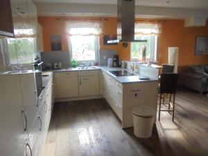 a kitchen with a sink and a stove top oven at Ferienwohnung Papst in Sittensen