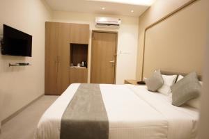 Letto o letti in una camera di A Square Executive Hotel