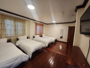 Postel nebo postele na pokoji v ubytování Villa Moa Baguio