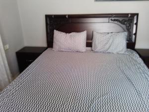 Postel nebo postele na pokoji v ubytování Ayola Apartment