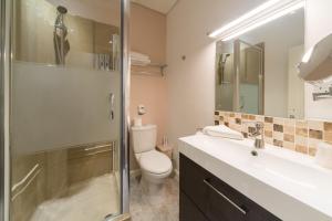 a bathroom with a toilet and a sink and a shower at The Melita in London