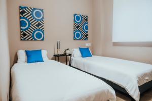Кровать или кровати в номере Suite85, Exclusivo Apartamento de diseño en la Playa