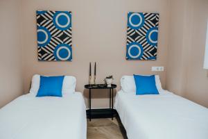 Кровать или кровати в номере Suite85, Exclusivo Apartamento de diseño en la Playa
