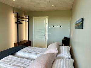 Letto o letti in una camera di Hrossholt