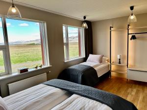 Letto o letti in una camera di Hrossholt