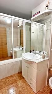 a bathroom with a sink and a tub and a toilet at TARONGERS MIRAMAR PLAYA - Alquiler solo a Familias in Miramar