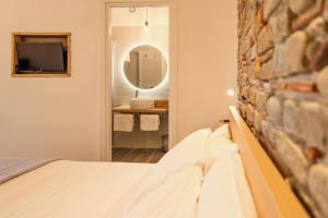 Postel nebo postele na pokoji v ubytování B&B Baia Di Trentova