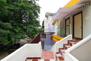 a stairway leading up to a house at Hotel O Krishna Hotel and Restaurant in Raipur
