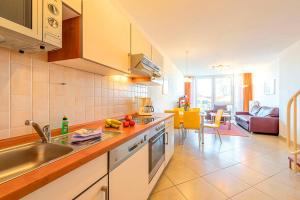 a kitchen with a sink and a counter top at Residenz Meeresblick D Fewo 17 in Rerik +12 photos