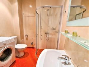 a bathroom with a shower and a toilet and a sink at MATEO Golden Sands 2 in Golden Sands