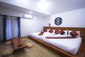 Postel nebo postele na pokoji v ubytování Chenfong Rakthai Resort-ไร่ชาเฉินฟงรีสอร์ท