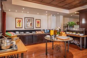 a large kitchen with a table and some food at DoubleTree by Hilton Hotel and Conference Center Chicago North Shore in Skokie