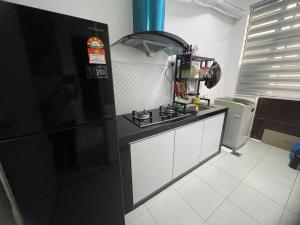 Kuchyň nebo kuchyňský kout v ubytování DM Homestay