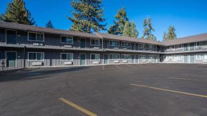 an empty parking lot in front of a building at Quality Inn South Lake Tahoe in South Lake Tahoe