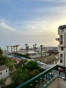a view of a parking lot next to a building at Sea View Apartment in Gallipoli
