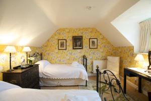 Postel nebo postele na pokoji v ubytování Goodwood Cottage + 19 fotografií